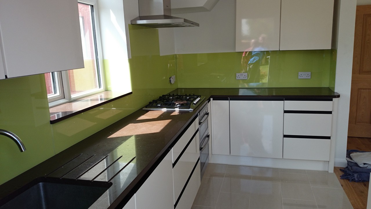 Lime green glass kitchen splashback installed by East Molesey glaziers