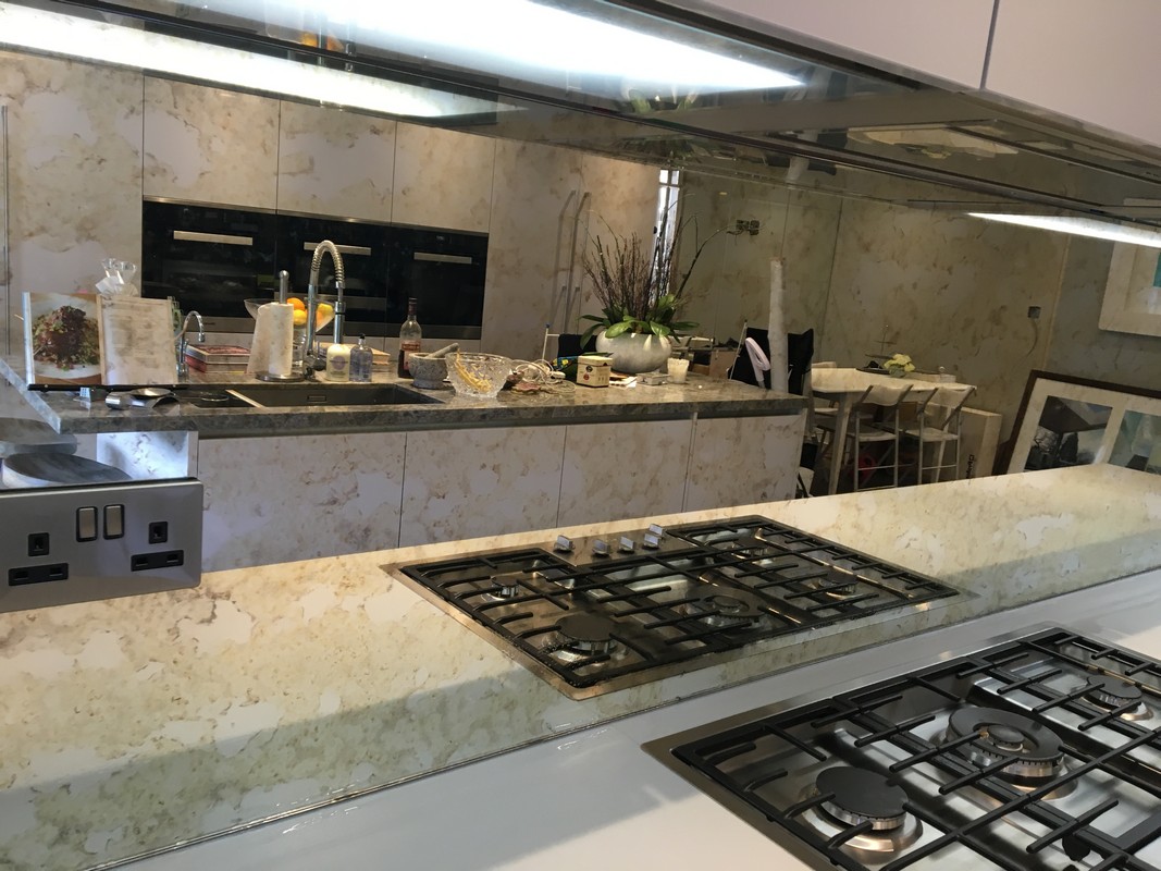 Mirror glass splashback in East Molesey luxury kitchen